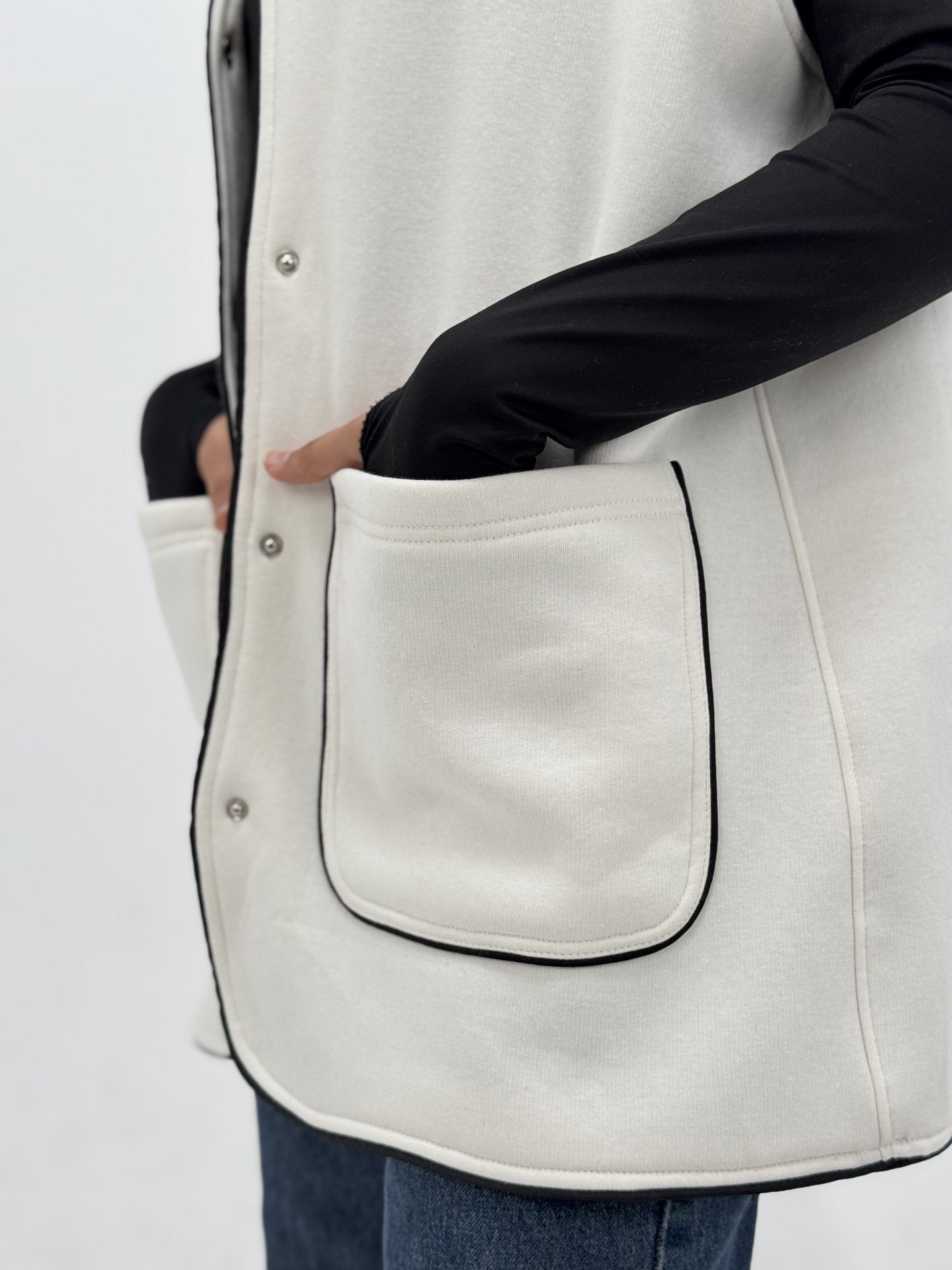 Off White vest with black trim