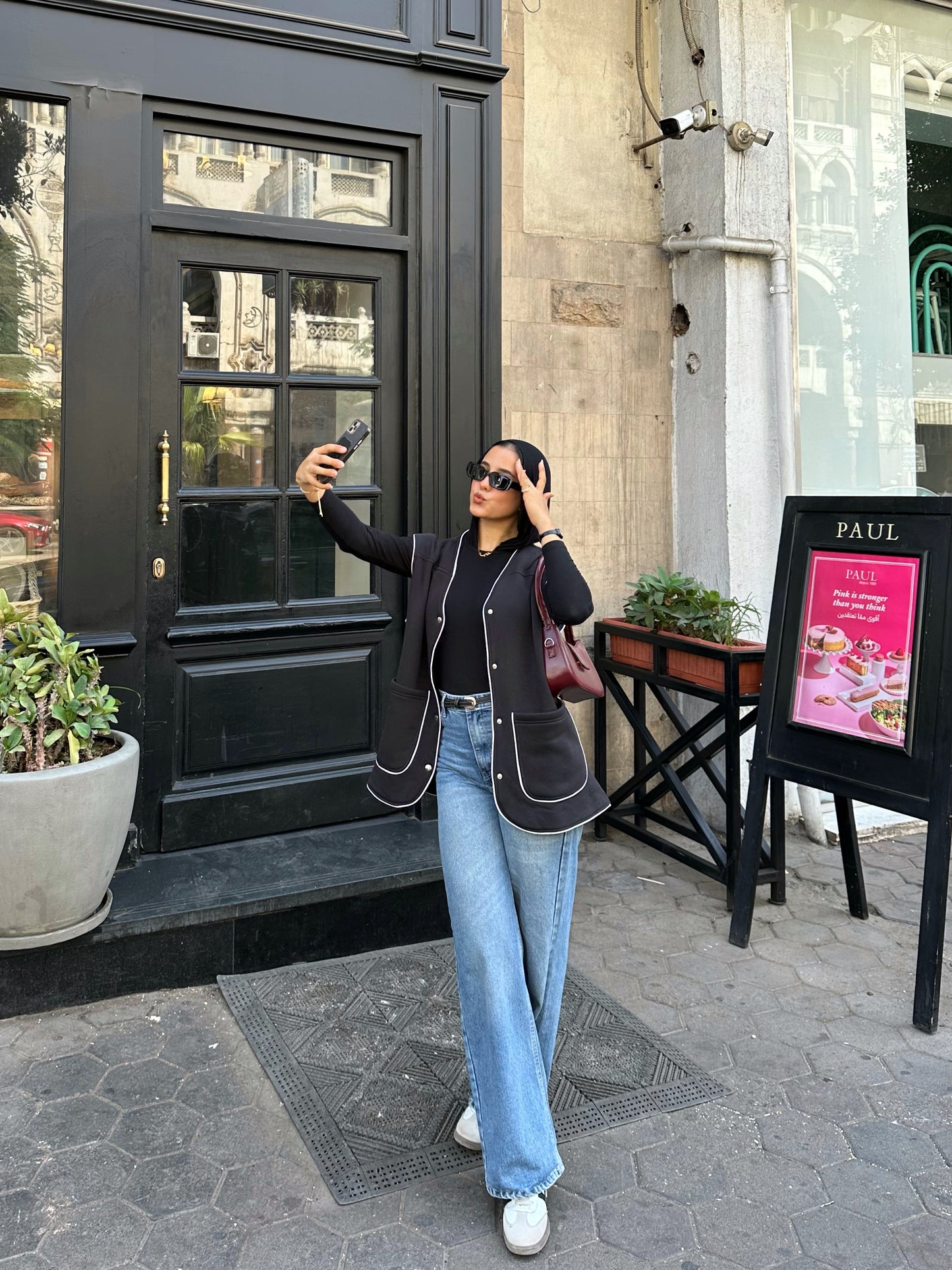 Black vest with white trim