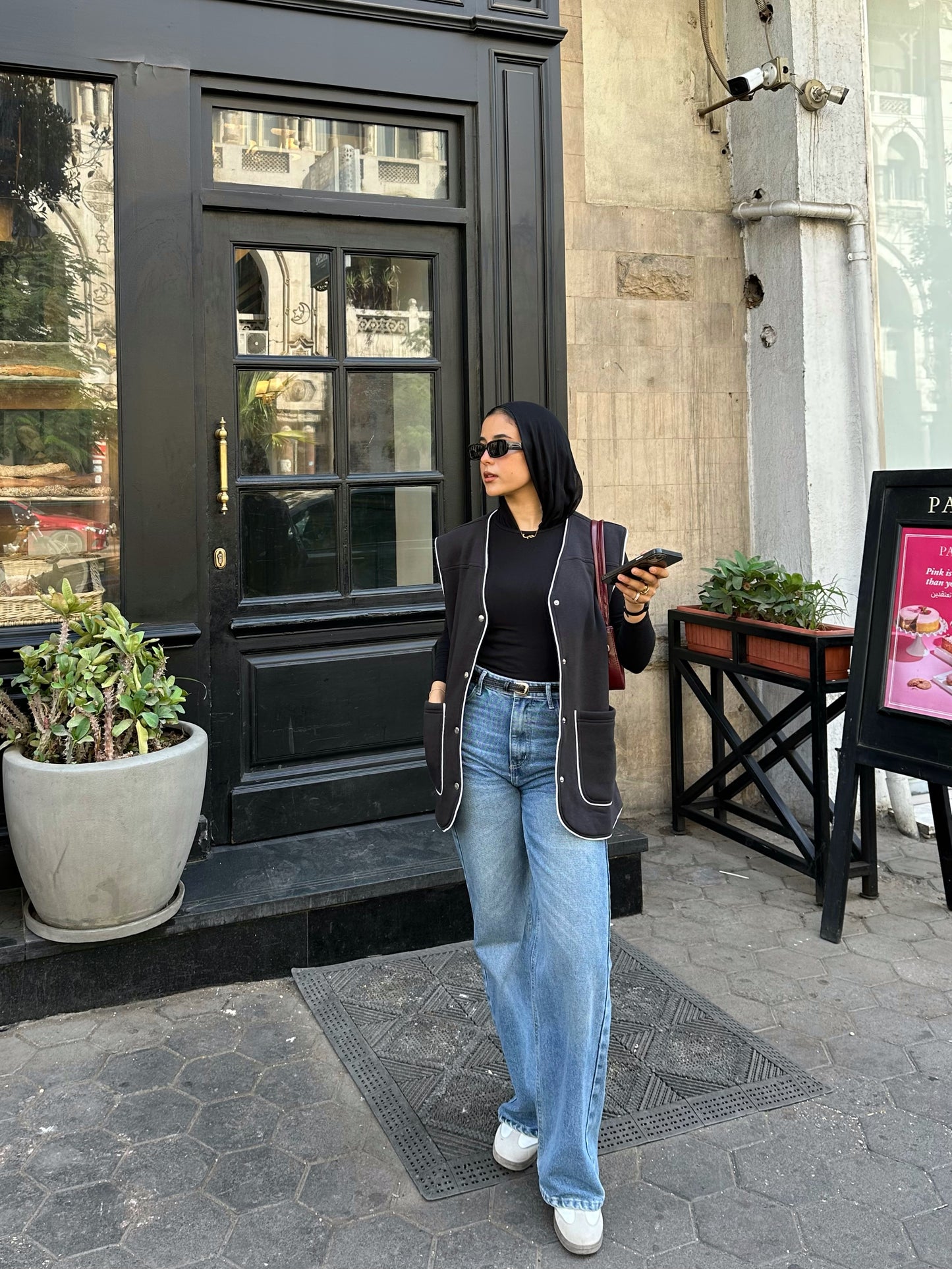 Black vest with white trim