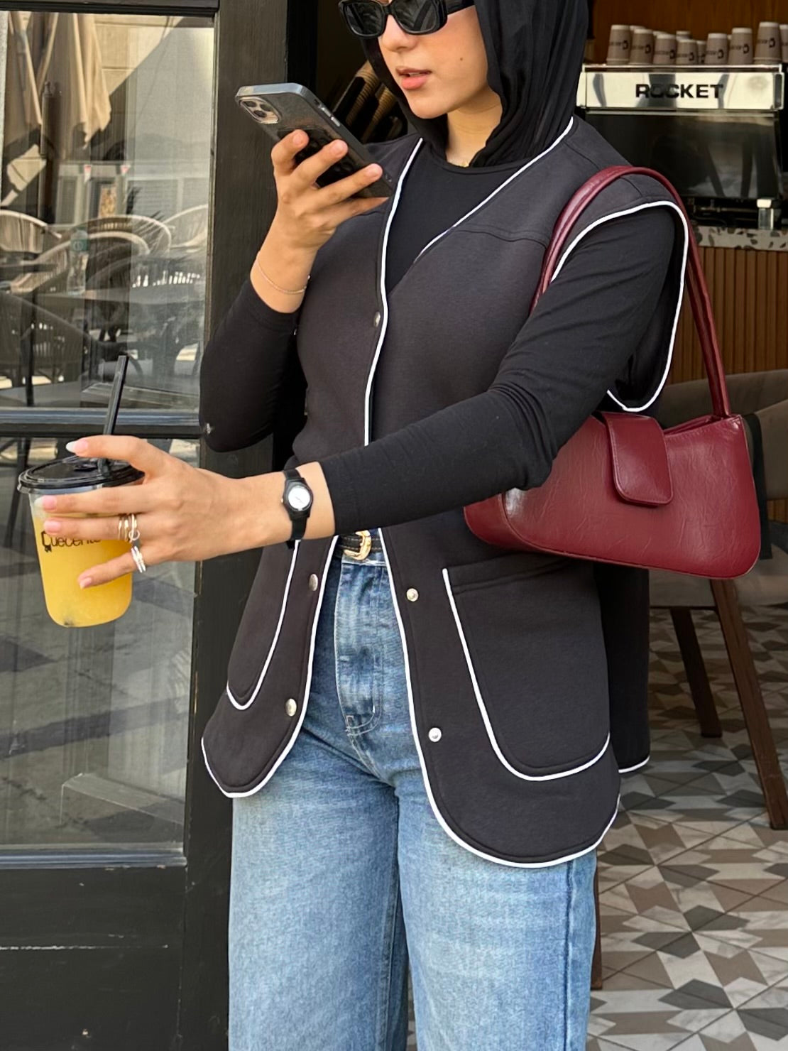 Black vest with white trim