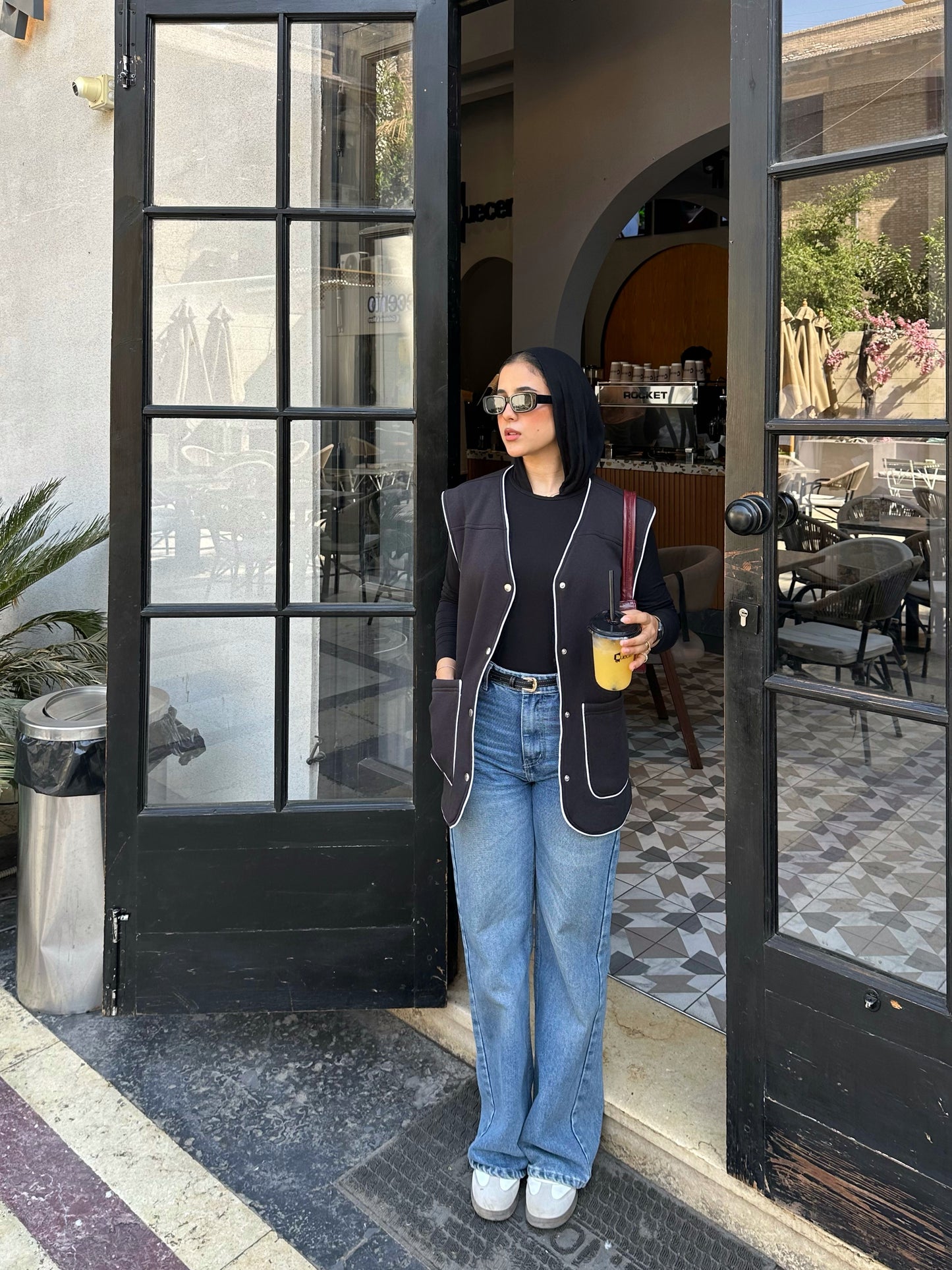 Black vest with white trim