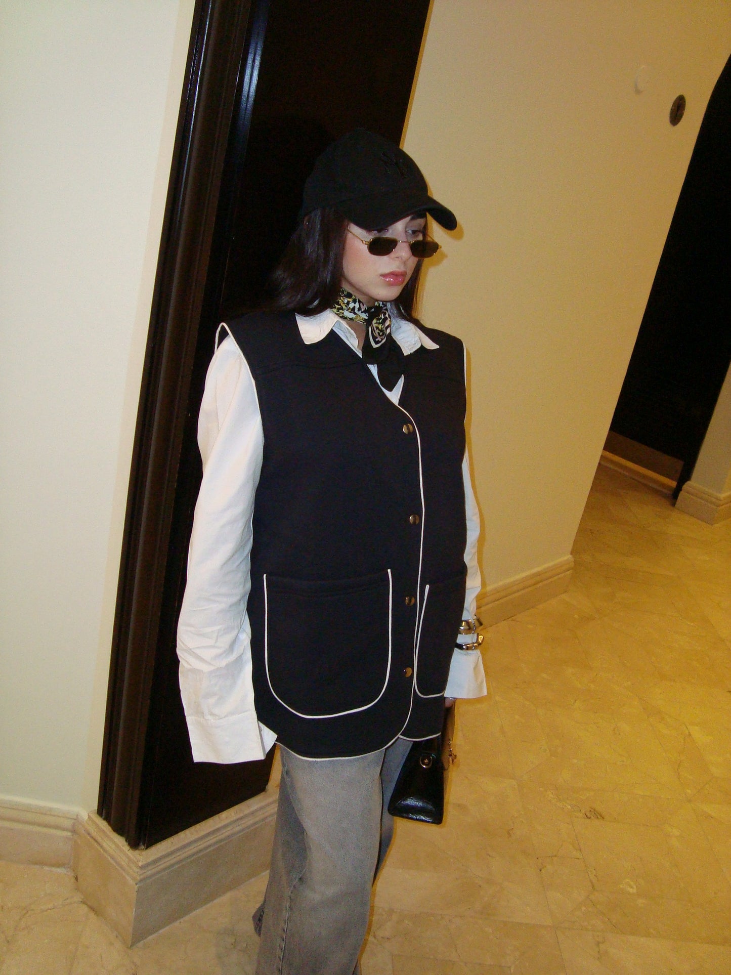 Black vest with white trim