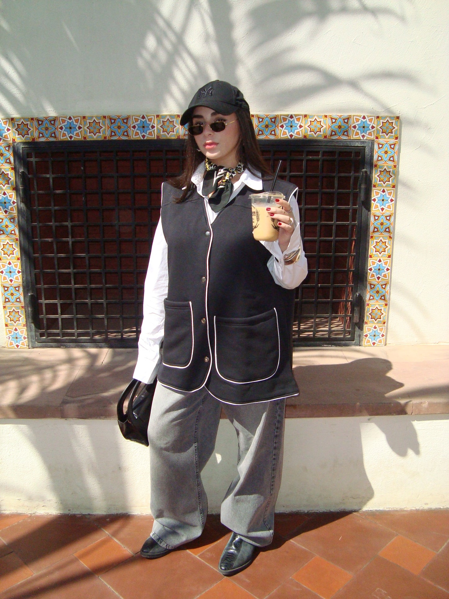 Black vest with white trim